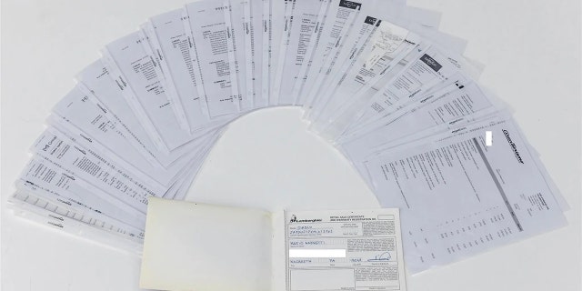 Mario Andretti's signature is on the original title and warranty paperwork.