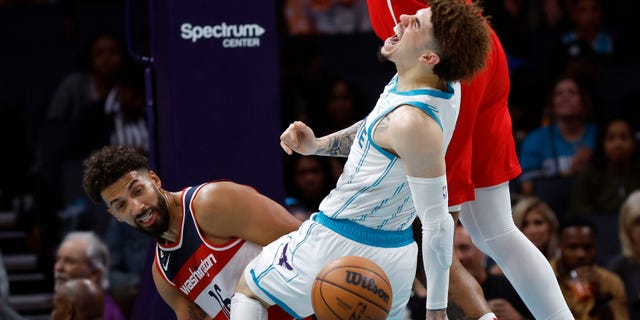 LaMelo Ball #1 of the Charlotte Hornets reacts as he is fouled and injured during the third quarter of the game against the Washington Wizards at Spectrum Center on Oct. 10, 2022 in Charlotte, North Carolina.