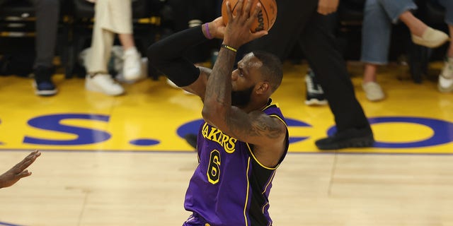 LeBron James of the Los Angeles Lakers attempts a 3-pointer during the season opener against the Golden State Warriors at Chase Center in San Francisco, California, on Tuesday.