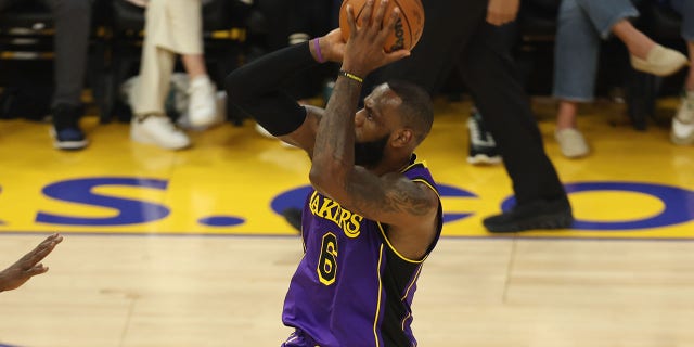LeBron James #6 of the Los Angeles Lakers shoots a three point basket during the season opener game against the Golden State Warriors on Oct. 18, 2022 at Chase Center in San Francisco, California.