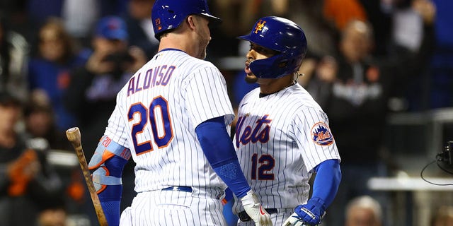 Francisco Lindor of the New York Mets celebrates a solo home run with Pete Alonso during the wild card series at Citi Field on Oct. 8, 2022.