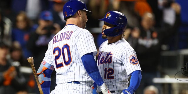 Francisco Lindor of the New York Mets celebrates a solo home run with Pete Alonso during the wild card series at Citi Field on Oct. 8, 2022.