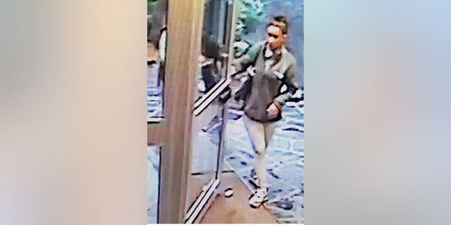 The suspect, a 24-year-old woman seen above on CCTV footage, was arrested Saturday.