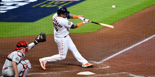 Martin Maldonado (15) of the Houston Astros hits an RBI single in the second inning during Game 1 of the 2022 World Series against the Philadelphia Phillies at Minute Maid Park Friday, Oct. 28, 2022, in Houston. 