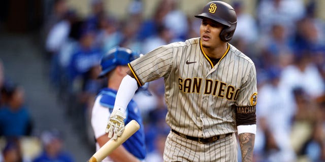 Manny Machado #13 of the San Diego Padres throws his bat after a first-innings single home run in game two of the National League Division Series against the Los Angeles Dodgers at Dodger Stadium on October 12, 2022 in Los Angeles, California.