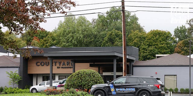 Police vehicles outside the Courtyard by Marriott seen on Wednesday, Oct. 5, 2022, where a Paul Kutz was shot and killed on Sunday.