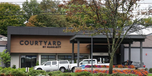 Police vehicles outside the Courtyard by Marriott seen on Wednesday, Oct. 5, 2022, where a Paul Kutz was shot and killed on Sunday.