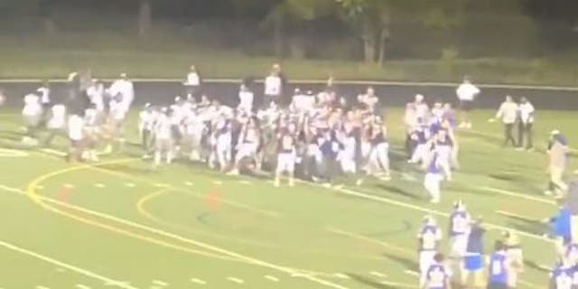 Football players at Gaithersburg High School and Northwest High School in Maryland fight during a game on September 16.