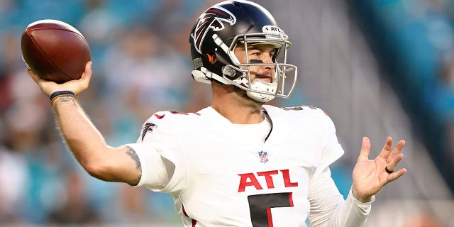 AJ McCarron #5 of the Atlanta Falcons looks to pass against the Miami Dolphins during a preseason game at Hard Rock Stadium on Aug. 21, 2021 in Miami Gardens, Florida.