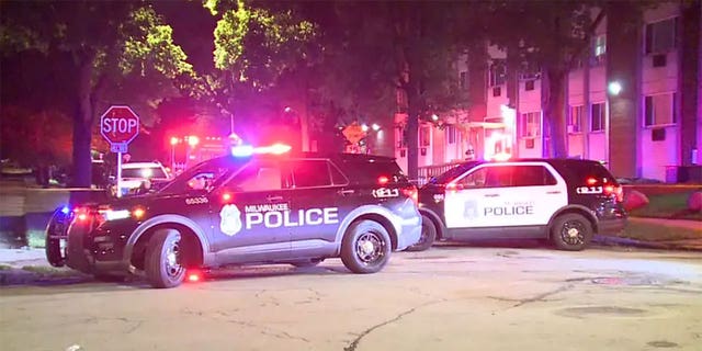 Milwaukee police respond to the scene where Regina "Mya" Allen was fatally shot.
