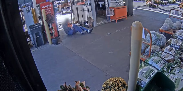 The elderly worker appeared to hit his head on a flowerpot and grab his leg while laying on the ground.