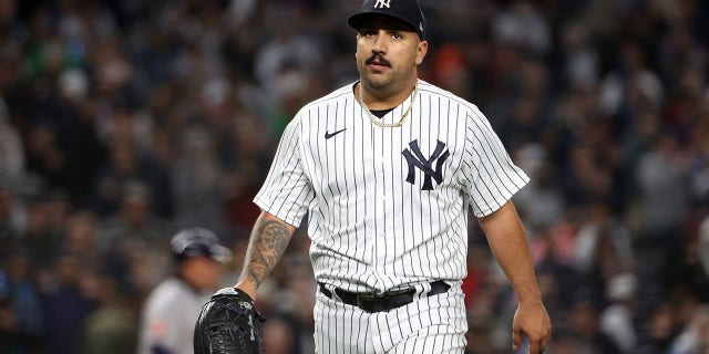 Nestor Cortes #65 of the New York Yankees walks back to the dugout during Game 4 of the ALCS between the Houston Astros and the New York Yankees at Yankee Stadium on Sunday, October 23, 2022, in New York, New York.