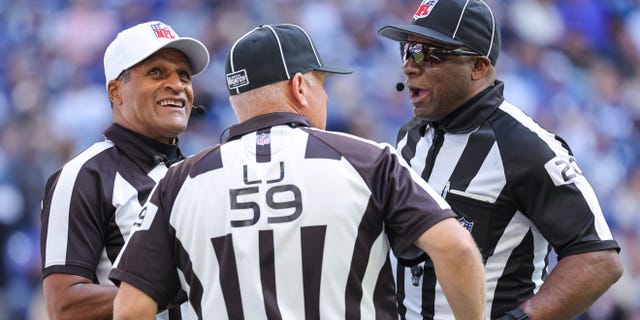 Referee Jerome Boger #23, line judge Rusty Baynes #59 and umpire Barry Anderson #20 are seen during the Indianapolis Colts and Jacksonville Jaguars game at Lucas Oil Stadium on October 16, 2022, in Indianapolis, Indiana.