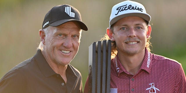 Team captain Cameron Smith of Punch GC, right, poses with Greg Norman, CEO and commissioner of LIV Golf, after winning the individual title at the LIV Golf Invitational - Chicago at Rich Harvest Farms Sept. 18, 2022, in Sugar Grove, Ill.