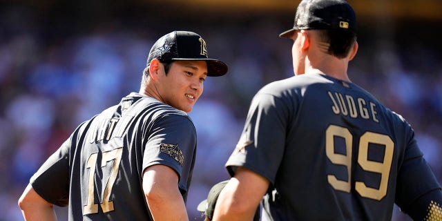 American League All-Stars Aaron Judge, right, and Shohei Ohtani line up before the All-Star Game at Dodger Stadium on July 19, 2022, in Los Angeles.