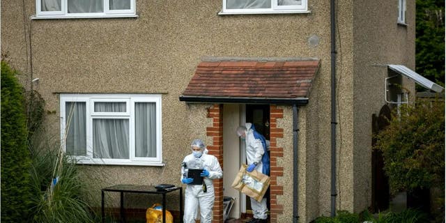 Police and forensic officers working at the Bradley Lewis stabbing scene on Chipperfield Drive, Kingswood, Bristol, England.
