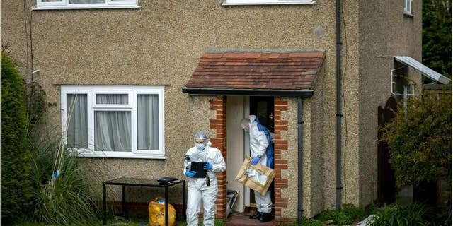 Police and forensic officers working at the Bradley Lewis stabbing scene on Chipperfield Drive, Kingswood, Bristol, England.