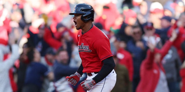 Oscar Gonzalez of the Cleveland Guardians celebrates after hitting a walk-off home run to end the game in the 15th inning against the Tampa Bay Rays in the second game of the wild-card series at Progressive Field on Oct. 8, 2022, in Cleveland.