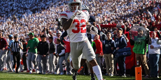 TreVeyon Henderson #32 of the Ohio State Buckeyes runs for a touchdown against the Penn State Nittany Lions during the second half at Beaver Stadium on October 29, 2022 in State College, Pennsylvania.