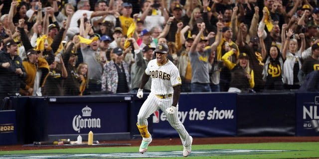 Juan Soto #22 of the San Diego Padres celebrates after hitting a RBI single during the seventh inning against the Los Angeles Dodgers in game four of the National League Division Series at PETCO Park on October 15, 2022 in San Diego, California.