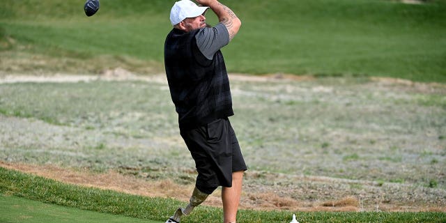 Marine Veteran Chris Nowak tees off during the PGA Hope event at Congressional Country Club October 17, 2022 in Bethesda, MD. PGA Hope has specialized golf programs for veterans dealing with PTSD, brain injuries or other issues.