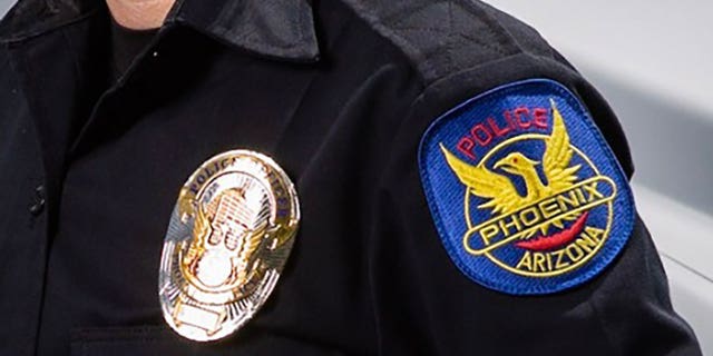 This file images shows a badge on a Phoenix police officer.