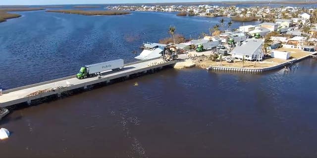 Trucks cross the newly-completed Pine Island Bridge. (Gov. Ron DeSantis)