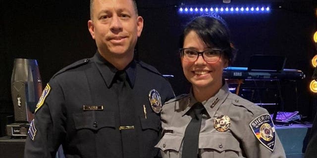 Escondido police Sgt. Jeff Valdivia and El Paso County Deputy Natalie Young take a picture together.
