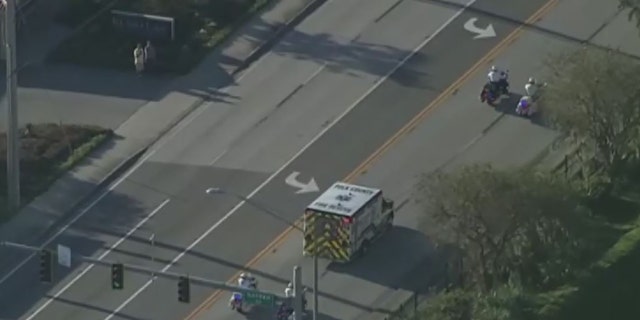 Deputies lead a procession for the deputy killed in a shooting early Tuesday.