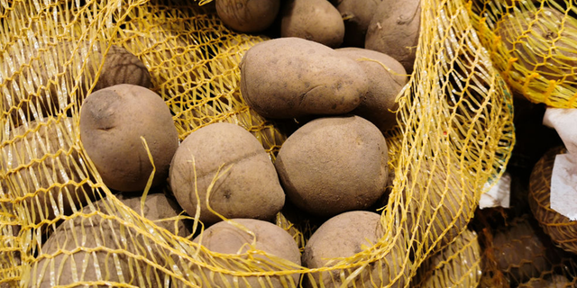 The two Australian men face multiple charges, including causing grievous bodily harm after launching potatoes at people.