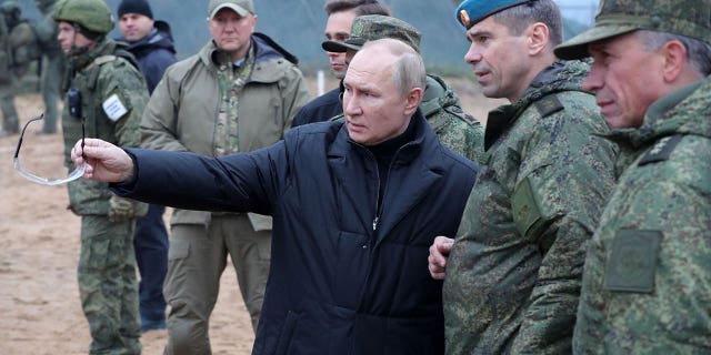 Russian President Vladimir Putin meets soldiers during a visit at a military training centre of the Western Military District for mobilised reservists, outside the town of Ryazan on Oct. 20, 2022.
