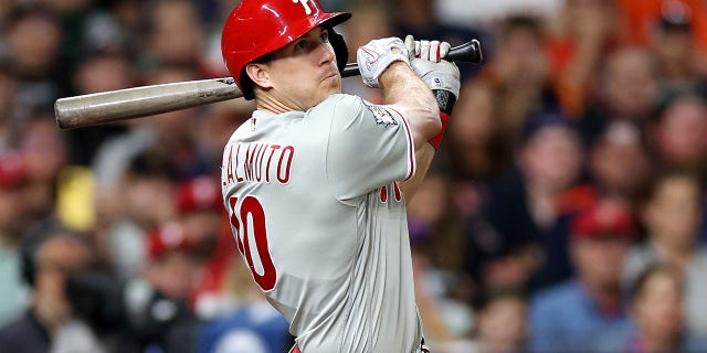 J.T. Realmuto #10 of the Philadelphia Phillies hits a home run in the 10th inning against the Houston Astros in Game One of the 2022 World Series at Minute Maid Park on October 28, 2022 in Houston, Texas.