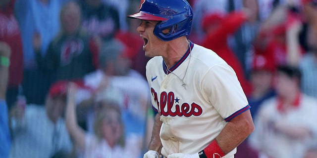 J.T. Realmuto of the Philadelphia Phillies celebrates an inside-the-park home run against the Atlanta Braves during the third inning of Game 4 of a National League Division Series at Citizens Bank Park Oct. 15, 2022, in Philadelphia.