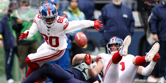 Richie James (80) of the New York Giants fumbles the ball against the Seattle Seahawks during the second quarter, Oct. 30, 2022, in Seattle, Washington.