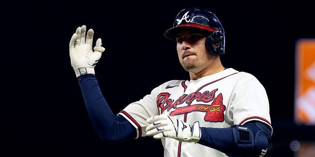 Austin Riley #27 of the Atlanta Braves reacts after a RBI single against the Philadelphia Phillies during the sixth inning in game two of the National League Division Series at Truist Park on October 12, 2022, in Atlanta, Georgia.