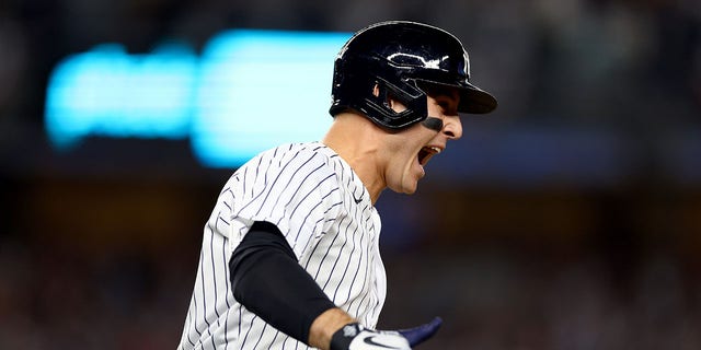 Anthony Rizzo #48 of the New York Yankees celebrates after hitting a two run home run against Cal Quantrill #47 of the Cleveland Guardians during the sixth inning in game one of the American League Division Series at Yankee Stadium on October 11, 2022 in New York, New York.