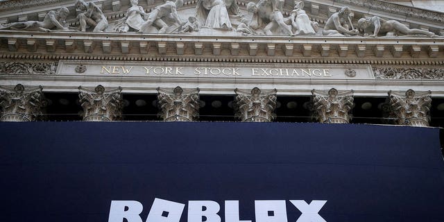 The Roblox logo is displayed on a banner on the front facade of the New York Stock Exchange in New York City, New York, on March 10, 2021. 