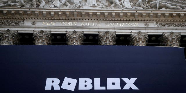 The Roblox logo is displayed on a banner on the front facade of the New York Stock Exchange in New York City, New York, on March 10, 2021.