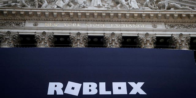 The Roblox logo is displayed on a banner on the front facade of the New York Stock Exchange in New York City, New York, on March 10, 2021. 