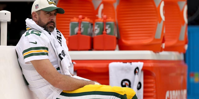 Aaron Rodgers of the Green Bay Packers looks on from the bench during the third quarter against the Washington Commanders at FedExField on Oct. 23, 2022, in Landover, Maryland.