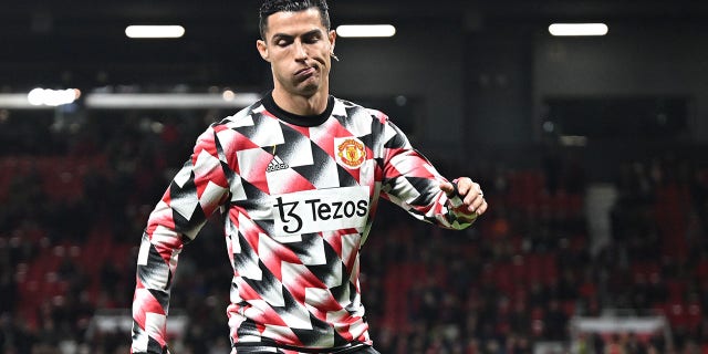 Manchester United striker Cristiano Ronaldo warms up before an English Premier League football game against Tottenham Hotspur at Old Trafford on October 19, 2022 in Manchester, England.