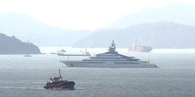 In this image taken from a video footage run by TVB, the megayacht Nord, center, worth over 0 million, is seen off Hong Kong Island outside Victoria Harbour on Friday, Oct. 7, 2022. 