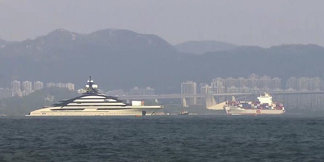 In this image taken from video footage run by TVB, the megayacht Nord, left, worth over 0 million, is seen off Hong Kong Island outside Victoria Harbour on Friday, Oct. 7, 2022. 