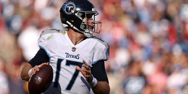Ryan Tannehill #17 of the Tennessee Titans scrambles with the ball during the second half against the Washington Commanders at FedExField on October 09, 2022 in Landover, Maryland.