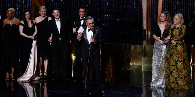 Eugene Levy, center, and the cast of "Schitt's Creek" accept the award for best comedy series at the 7th annual Canadian Screen Awards in Toronto March 31, 2019.