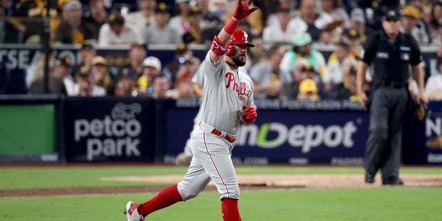 Kyle Schwarber #12 of the Philadelphia Phillies reacts after hitting a home run during the sixth inning against the San Diego Padres in game one of the National League Championship Series at PETCO Park on October 18, 2022 in San Diego, California.