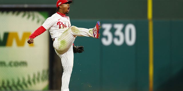 Gene Segura #2 of the Philadelphia Phillies celebrates after making a diving stop and throwing out Ha-seong Kim #7 of the San Diego Padres (not pictured) at first base during the seventh inning in game three of the National League Championship Series at the Nationals Banks Park on October 21, 2022 in Philadelphia, Pennsylvania.