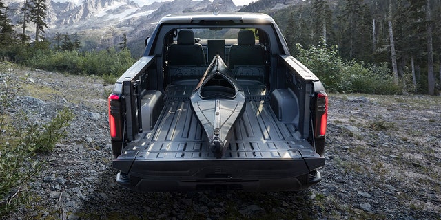 The GMC Sierra EV Denali's bed can be opened up into the cabin to carry longer items.