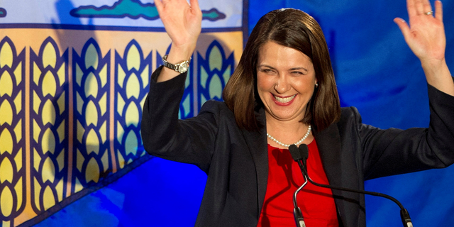 Alberta Premier Danielle Smith reacts with a smile after she lost the provincial election in High River, Alberta, on April 23, 2012.