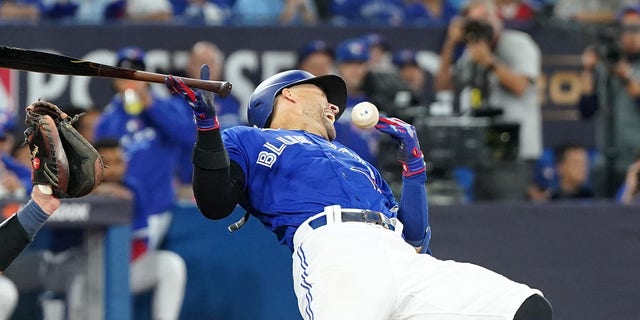 George Springer of the Toronto Blue Jays is hit by a pitch during the eighth inning against the Seattle Mariners in Game 1 of the American League wild-card series at Rogers Centre on Oct. 7, 2022, in Toronto.